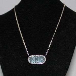 Kendra Scott silvertone necklace with blue oplalescent stone
